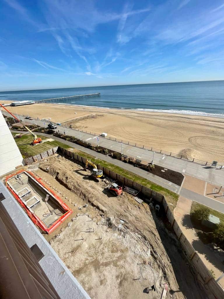 view of hotel pool construction and the ocean