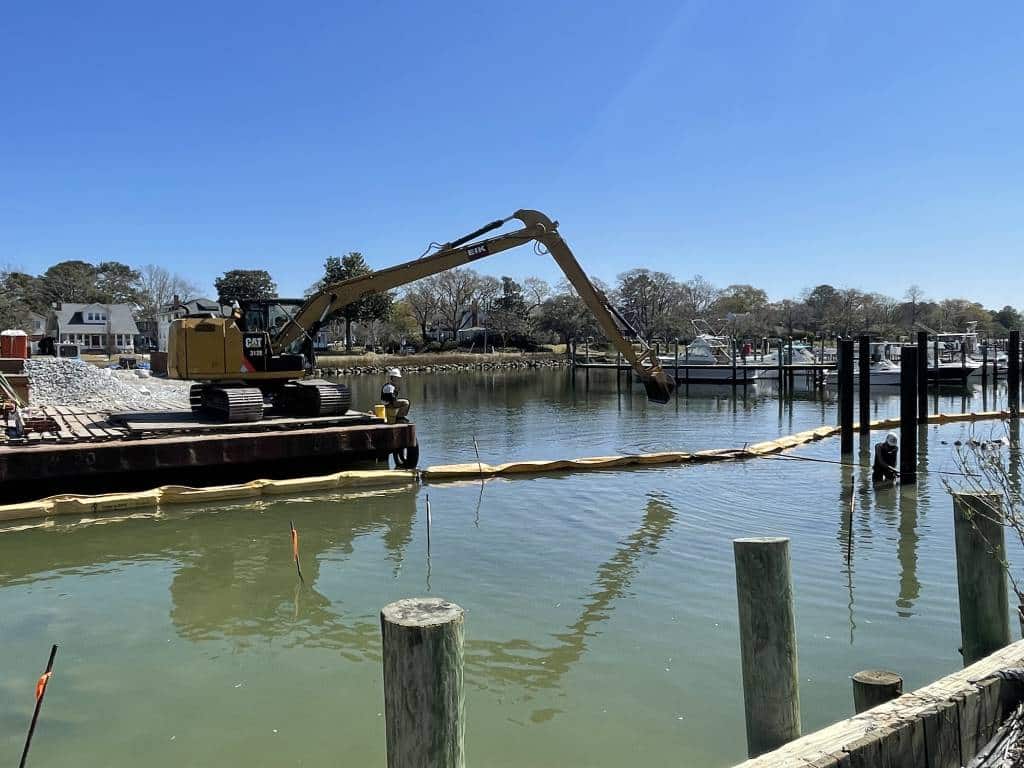 crane on barge working on sediment control